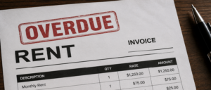 Overdue rent invoice with a bold red 'OVERDUE' stamp on top left corner, displaying Rental details and amounts.